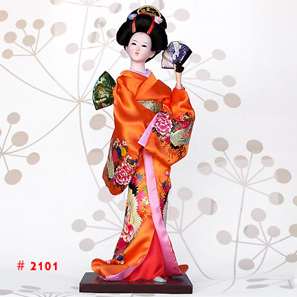 Orange Geisha Doll Holding A Fan